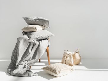 Pillows and a blanket on a chair