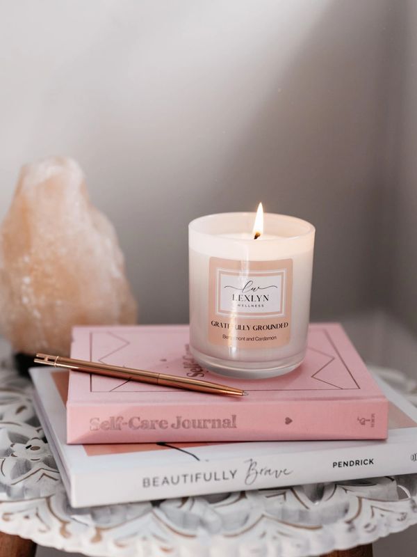 Gratefully Grounded scent on top of self care books and journals