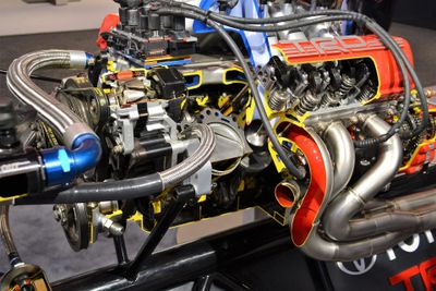 Detailed view of a high-performance car engine with exposed components.