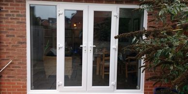 Outward opening UPVC French doors with 2 side panels fitted by Mansfield Front Doors in Mansfield.