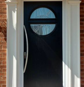 Anthracite Grey circle style Solid Core door with Long Bow handle fitted by Mansfield Front Doors.
