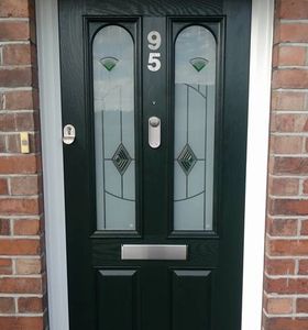 Handleless black 2 panel 2 square Solid Core door with ingot knocker fitted by Mansfield Front Doors