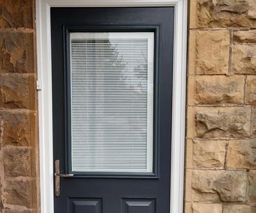 Anthracite Grey Solid Core composite door with integrated blinds fitted by Mansfield Front Doors.