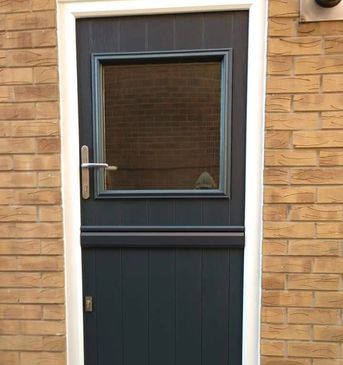 Black Solid Core composite Stable door fitted in Chesterfield by Mansfield Front Doors.