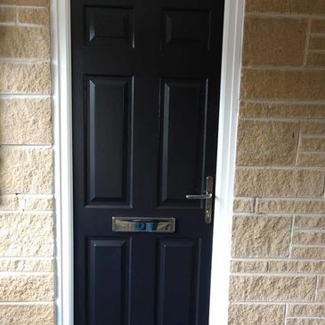 6 panel FD30 Composite Fire Door in black fitted in Chesterfield by our trained installers.
