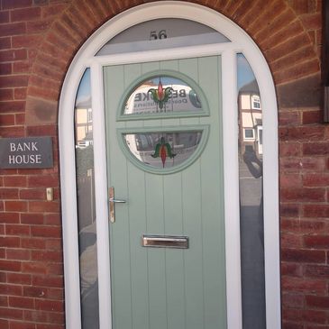 Circle style Chartwell Green Arched Solid Core composite front door fitted in Ladybrook Mansfield.