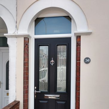 Black 2 panel 2 square Solid Core composite door with top light fitted in Mansfield.