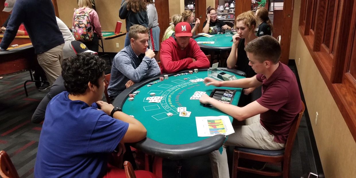 People playing at a casino table