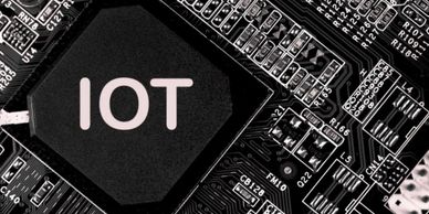 Close-up of an IoT chip on a circuit board.