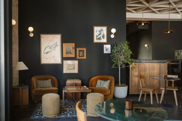 Cozy cafe corner with warm lighting and vintage decor.