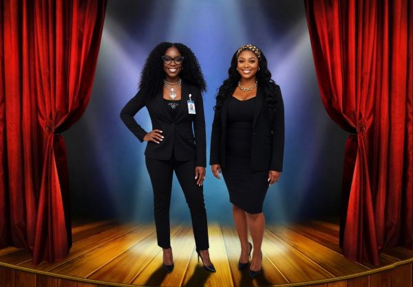 Two confident women in black business attire pose on a stage with red curtains.