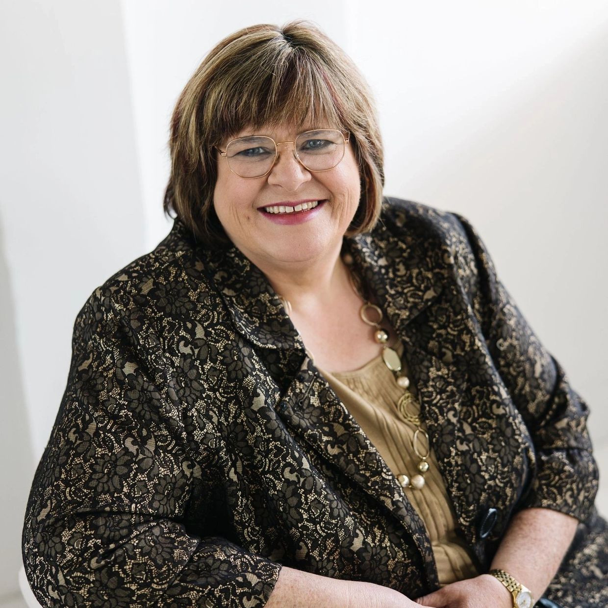 Woman sitting in chair smiling