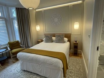 Overview of the spacious Fern ground floor room at Beach Lodge, showcasing comfort and style