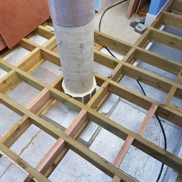 Wooden frame construction around a concrete pipe.