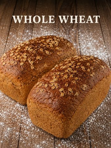 Two loaves of whole wheat bread on a wooden surface.