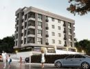 Modern multi-story building with balconies and parked cars.