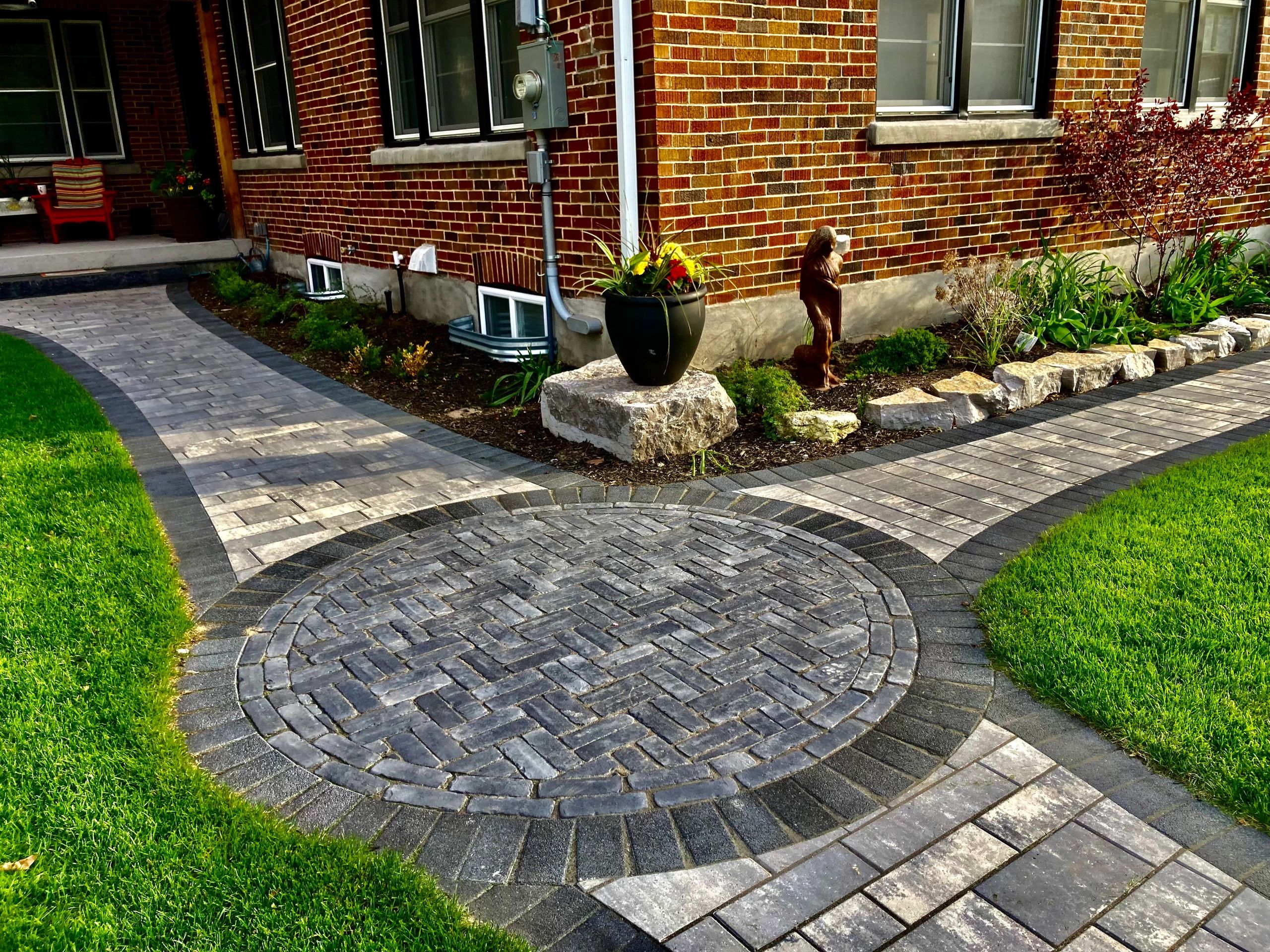 Stunning modern front yard landscape design with unique symmetry and premium materials in Alliston 