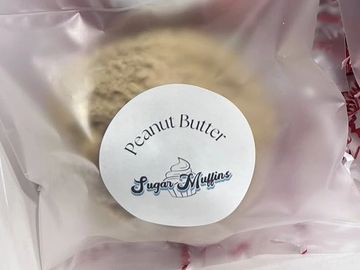 Peanut Butter Sugar Muffins in a clear plastic bag with a round label.