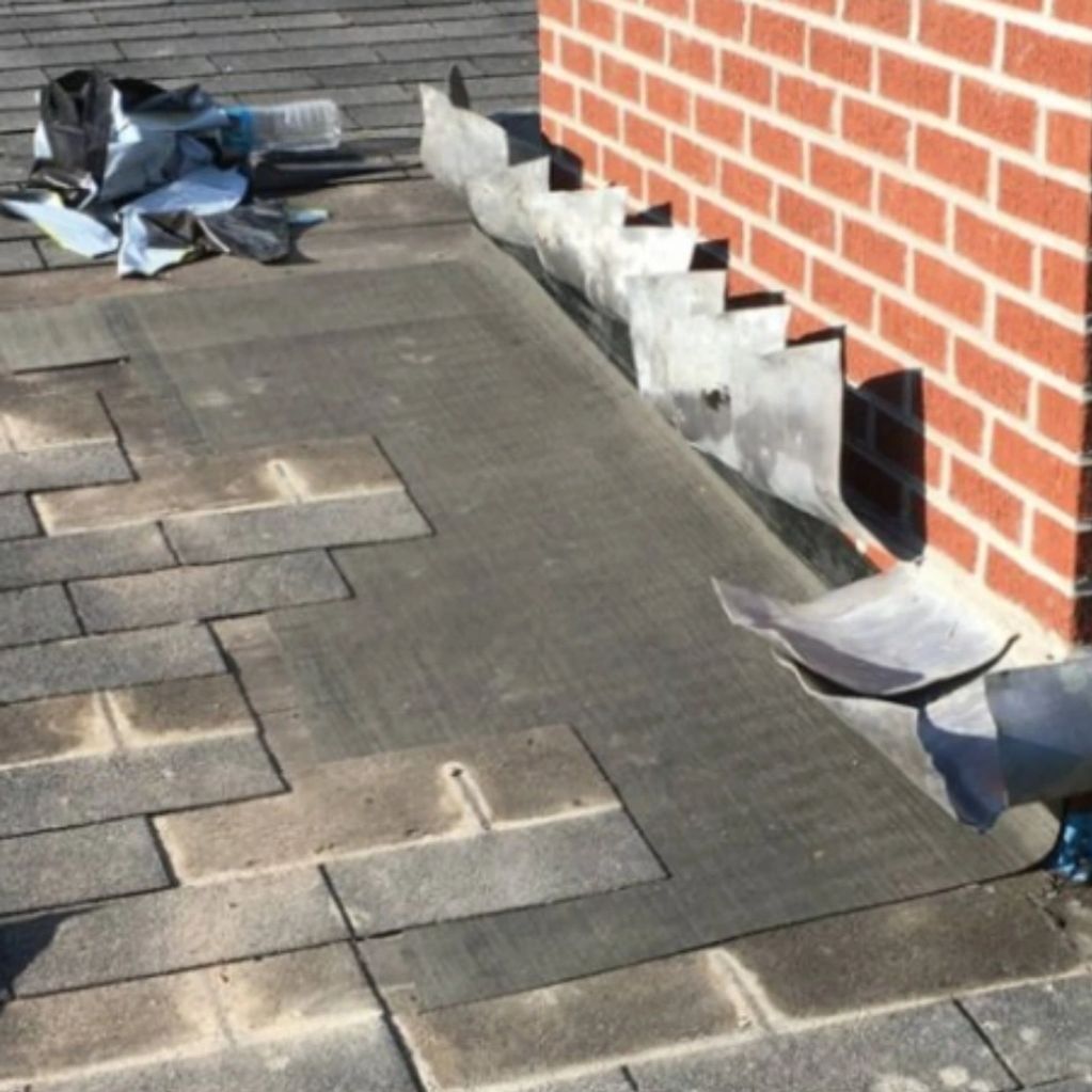 New base flash is key when waterproofing a chimney repair. Then step flashing followed by the lead.