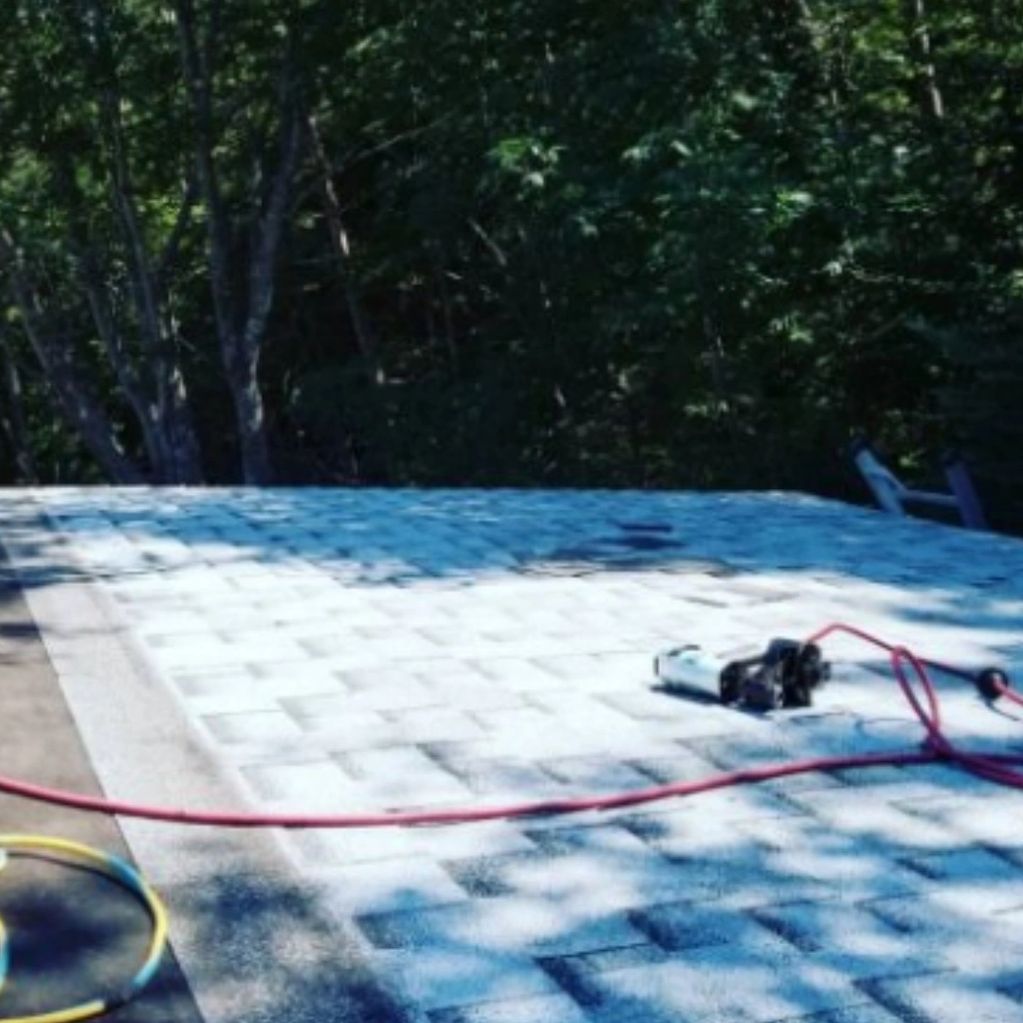 New shingled garage easy work on a friday. Removal of chimney and a new roof to stop water damage.