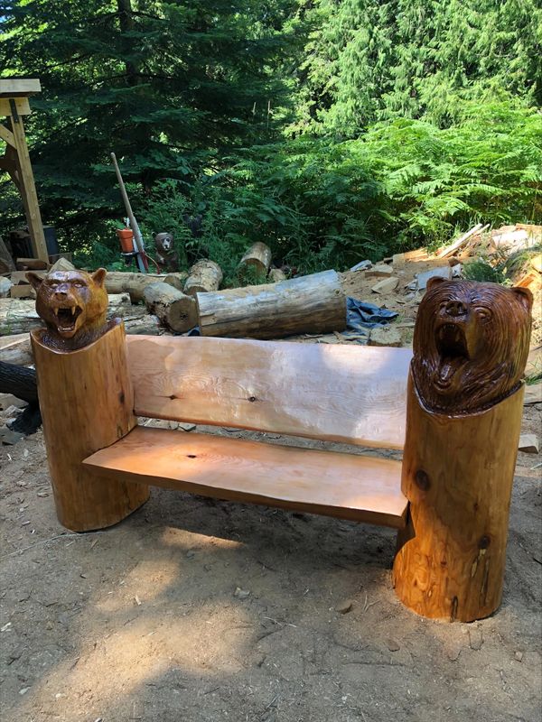 Park bench chainsaw carving with animal carving