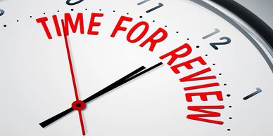 Clock with Time for review written on it.