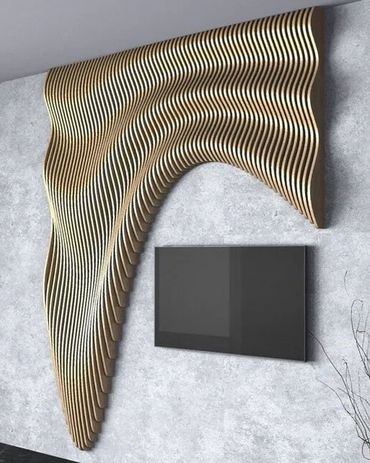 Modern wall art with wavy wooden slats above a mounted TV.