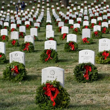 Graves with wreaths laid on them.