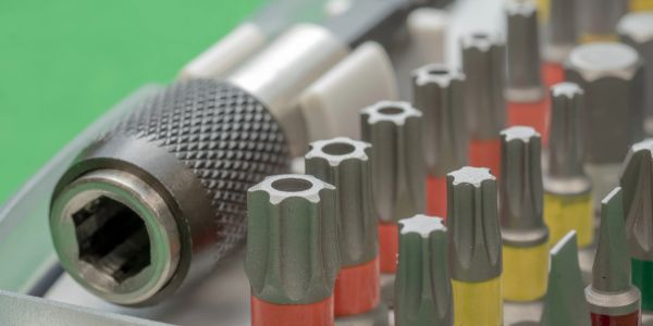 Close-up of a multi-bit screwdriver set.