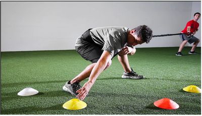 A person doing agility cone drills