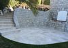 Terrace with stone walls, travertine stones and wrought iron railings St. Paul de Vence