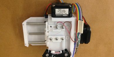 A stepper-driven XY table for neurological experiments, electro-mechanical, electro-optical, Raleigh