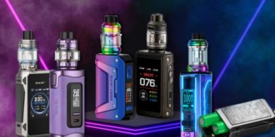 Collection of colorful vape devices on neon-lit surfaces.