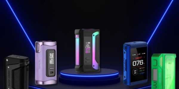 Five different modern vape mods displayed on a dark stage.