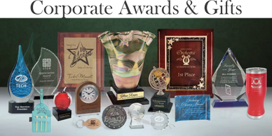 A collection of various corporate awards and trophies displayed together.