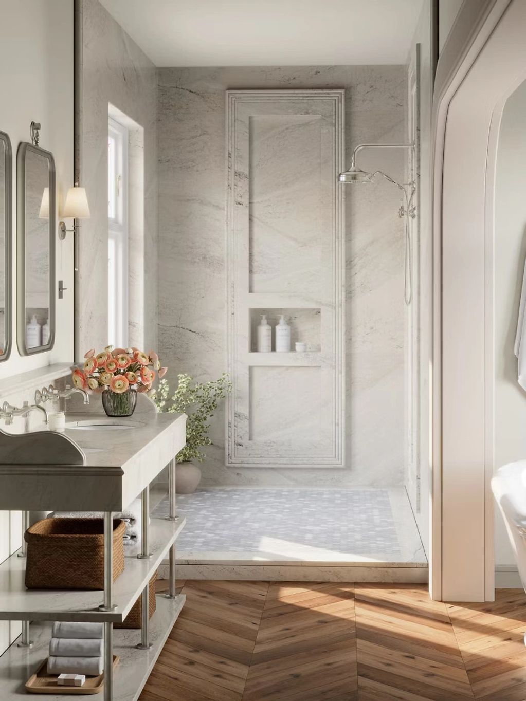 Elegant bathroom with marble shower and wooden herringbone floor.