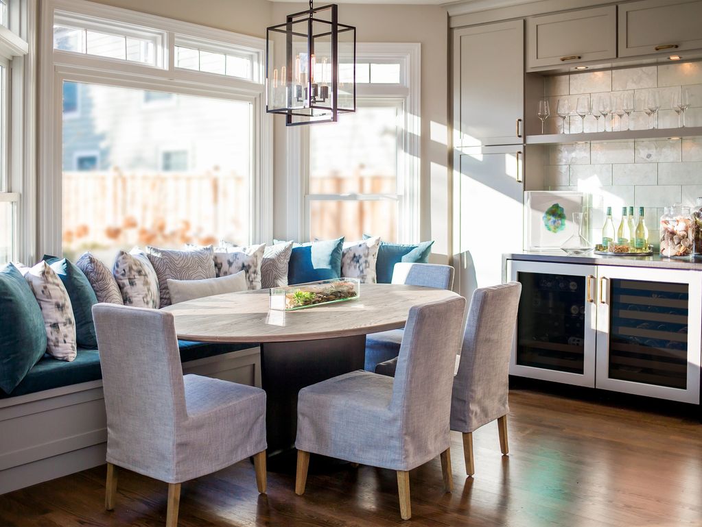 Bright dining nook with cushioned seating and modern decor.
