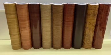 Various wood-patterned rolls in a row.