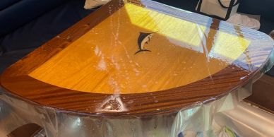 Wooden table wrapped in plastic wrap.