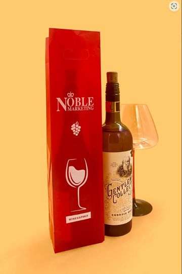 Red wine gift bag with a bottle and wine glass.