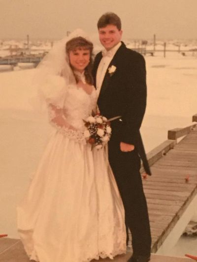 Classic 1990's white satin, beaded lace, BIG skirts and sleeves! 
Alicia and Gary Turner, Jan. 1996.