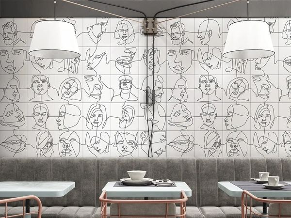 Modern cafe interior with abstract line art wall and minimalist furniture.