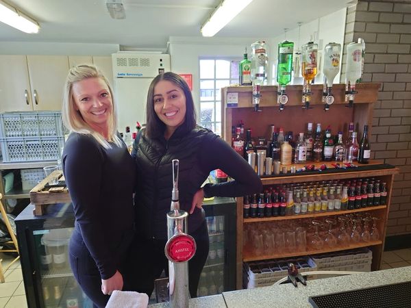 Staff ready to serve alcohol at wedding bar 