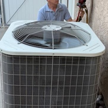 Affordable Heating and Air Conditioning technician performing professional AC diagnostics and repair
