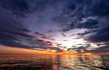 Dramatic Block Island Sound Sunrise with purple skies on the horizon.