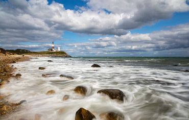 Dramatic clouds with Montauk lighthouse and ocean