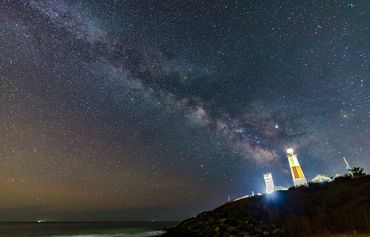 Montauk lighthouse against a starry night