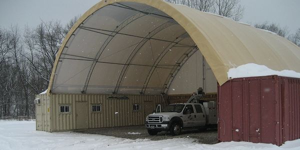 Hoop Structure on containers for a construction project with high snow load by construction tent