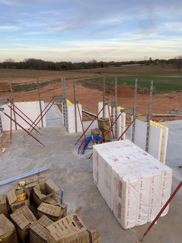 Quad-Lock insulated concrete form wall panels being stacked on a custom home around Duncan, OK.