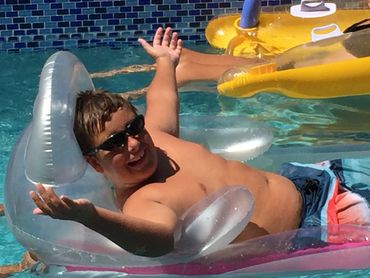 A men relaxed on a pool